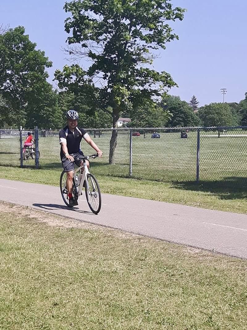 Eric riding a borrowed hybrid bike during the 2017 Cambridge Tour de Grand — his first 100 km ride